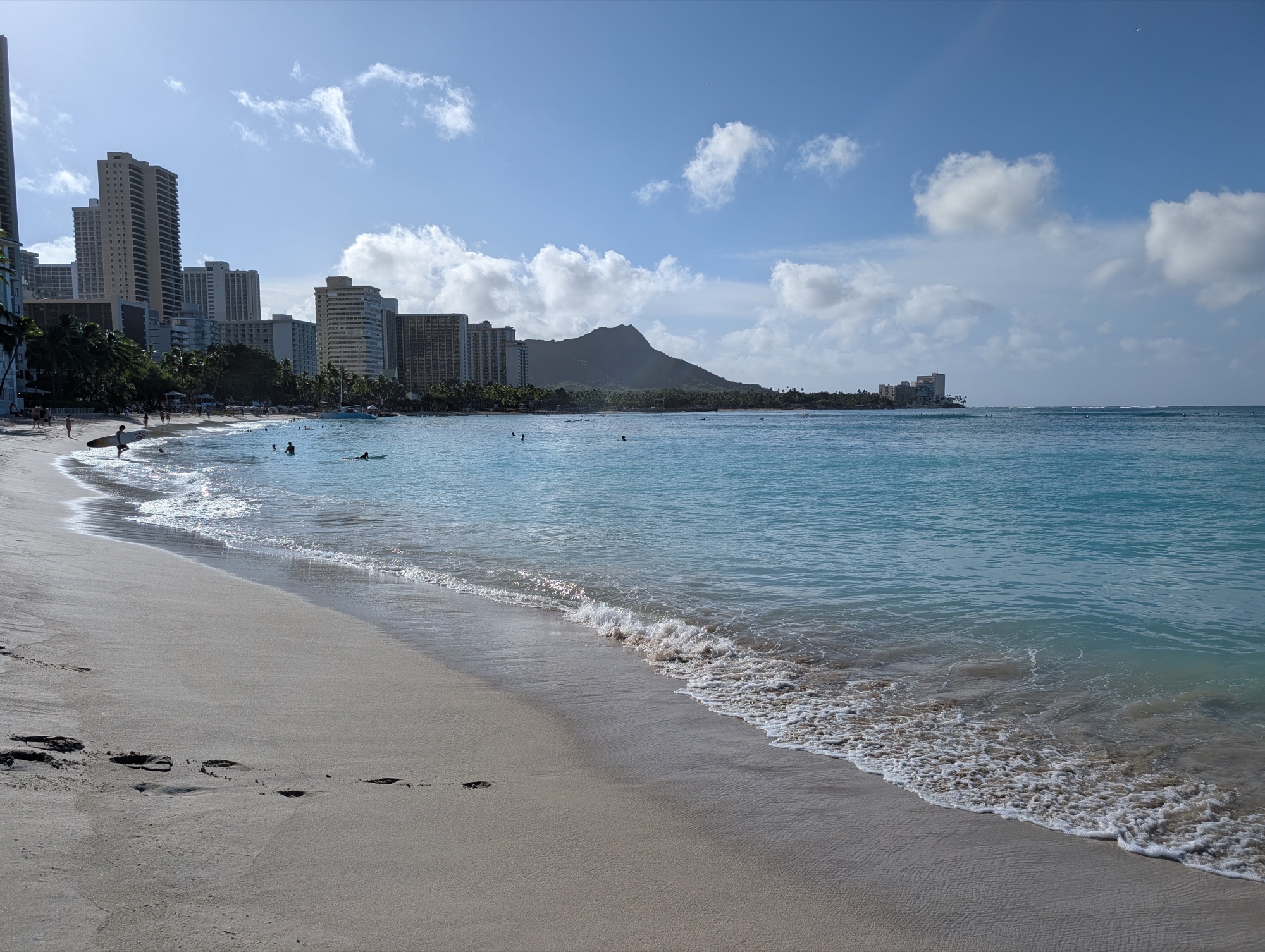 Waikiki beach curving away towards Diamond Head, with hotels lining the
shore